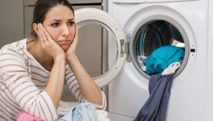 stressed-woman-doing-laundry-medium-shot.jpg